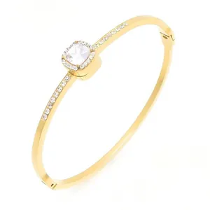 Elegant women's 18K gold plated titanium steel bangle with square rhinestone cluster