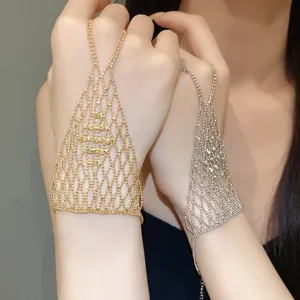 Close-up showing the intricate hollow mesh design of this golden hand-back chain.