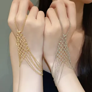 Close-up view of hollow tassel ring bracelet one-piece chain in gold and silver metal finish