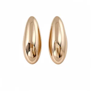 Minimalist gold oval stud earrings with smooth metallic finish in light luxury style.