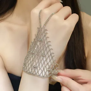 Close-up of a silver hollow beaded hand harness bracelet with mesh triangular design.