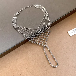 Macro view of silver bead tassel slave bracelet with hollow lattice ring connector