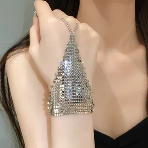 Close-up of a silver metallic mesh hand chain ring bracelet showing exquisite detail on hand