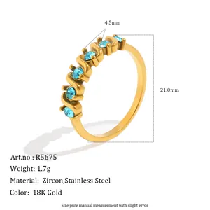 Detailed macro view of 18K gold-plated stainless steel ring featuring blue zircon stones