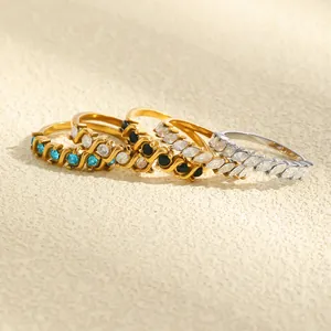 Macro view of 18K gold plated stainless steel rings with colorful marquise crystals