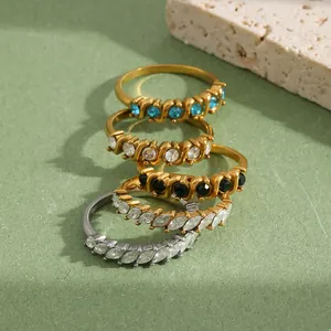 Close-up detail of luxury 18K gold-plated stainless steel rings with colorful stones