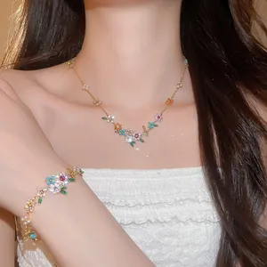 Detailed close-up view of a colorful zircon flower necklace and bracelet jewelry set.