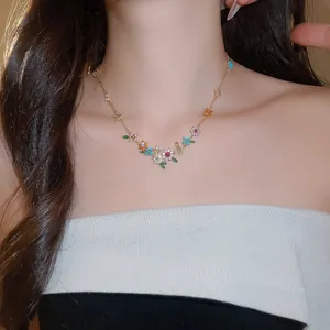 Exquisite 18k gold plated necklace with colorful zircon flower clusters on model