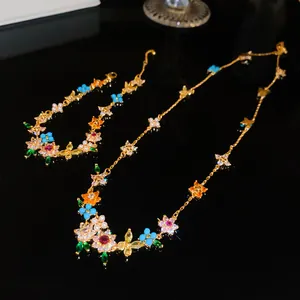 Detailed view of colorful zircon flower necklace and bracelet jewelry set in gold finish