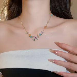 18k gold plated floral necklace featuring colorful cubic zirconia gemstones on model