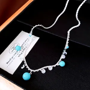 Elegant silver-tone lace necklace with turquoise beads and zircon pendants in a luxury box