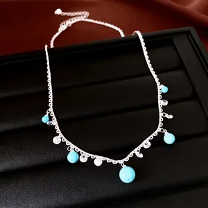 Elegant minimalist silver lace necklace featuring sky blue beads and sparkling zircon pendants