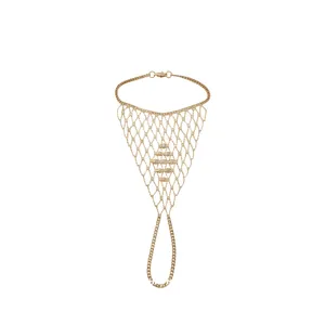 Intricate gold mesh hand harness ring bracelet with ornate crystal center detail