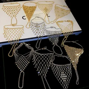 Detailed showcase of multiple gold and silver mesh fringe slave bracelets on a stand.