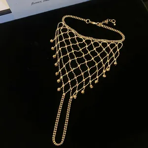 Close-up of an elegant gold hollow tassel slave bracelet featuring intricate mesh work