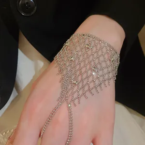 Detailed view of silver mesh ring bracelet with sparkling tassels and crystal accents.