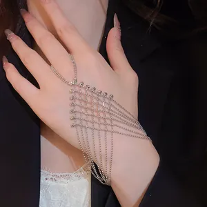Detailed close-up view of an elegant silver fringe mesh hand harness ring bracelet