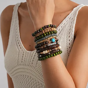Multi-layered ethnic wooden beaded elastic bracelets featuring a turquoise stone