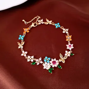 18k gold plated bracelet with zircon flowers and butterflies, luxury jewelry piece.