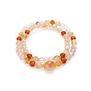 Elegante pulsera de doble capa con cuentas de vidrio naranja y piedras ojo de tigre.
