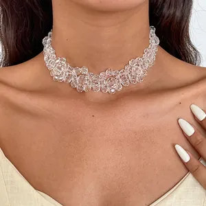 Detailed close-up view of a sparkling clear glass beaded choker necklace on model skin