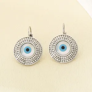 Boucles d'oreilles œil maléfique en acier inoxydable avec halos de strass étincelants