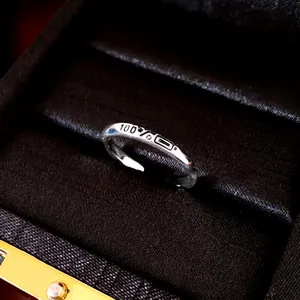 Minimalist silver open ring with 100% percentage and geometric engraving