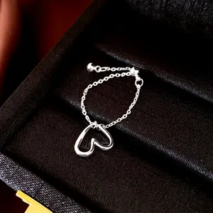 Elegant sterling silver adjustable chain ring with a delicate hollow heart pendant charm