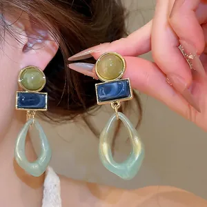 Vintage geometric acrylic pendant earrings in green and blue marble design