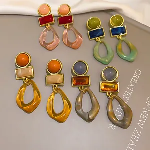 Detailed view of vintage geometric acrylic drop earrings featuring multiple color options
