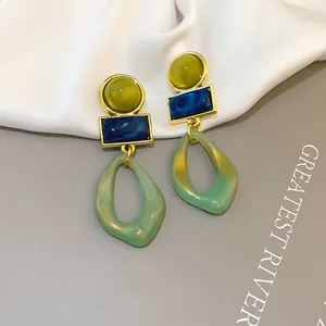 Vintage geometric acrylic drop earrings with green and blue resin accents in gold setting