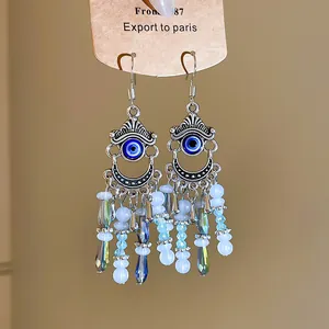 Boucles d'oreilles bohèmes vintage à pampilles en cristal avec un motif œil bleu