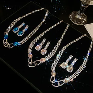 Detailed shot of sparkling rhinestone necklace and earring sets with oval pendants