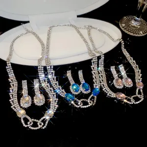 Detailed view of elegant rhinestone necklace and earring set with oval crystals for banquets