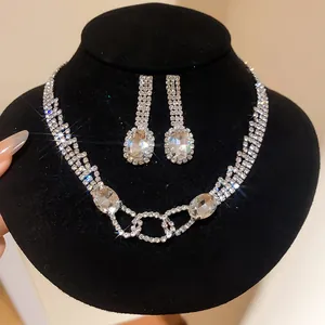 Close-up of sparkling rhinestone necklace and oval pendant earrings for banquet