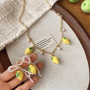 Sweet resin lemon and pearl jewelry set with gold chain necklace and bow earrings