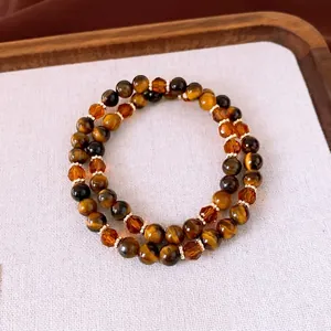 Bracelet double rang en perles d'oeil de tigre avec entretoises dorées et cristaux ambrés