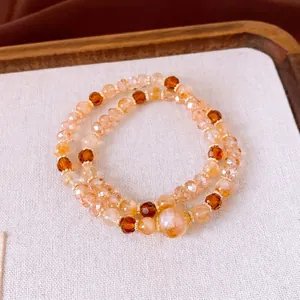 Bracelet multicouche élégant en perles d'oeil de tigre avec accents dorés pour femme