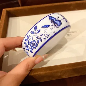 Vintage blue and white porcelain resin bangle with butterfly and flower patterns