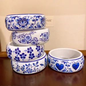 Detailed macro view of various blue and white porcelain pattern resin bangles