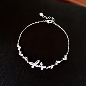 Detailed view of an elegant silver bracelet featuring cubic zirconia butterflies and flowers