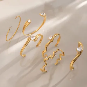Collection of 18k gold plated stainless steel bangles with sparkling zircon accents