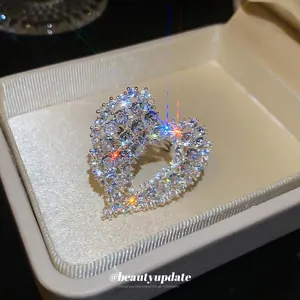 Elegant zircon hollow heart open ring in sterling silver inside a luxury jewelry box