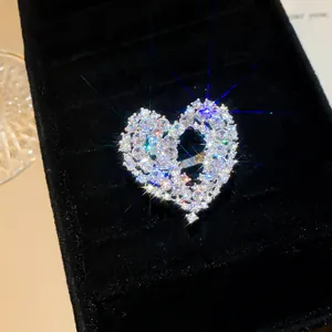 Close-up detail of a sparkling hollow heart ring with encrusted cubic zirconia