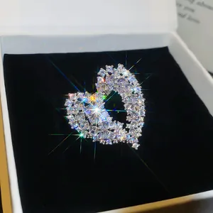 Detailed macro view of a luxury silver hollow heart ring featuring sparkling zircons