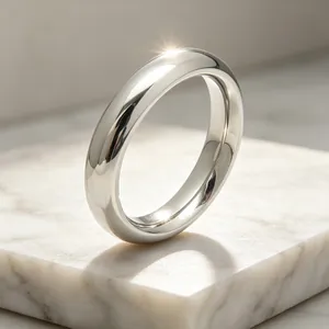 Detailed close-up of a 4mm smooth 304 stainless steel plain band ring with polished silver finish