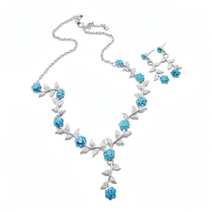 Elegante zilveren ketting en oorbellen set met blauwe bloemen en strass bladeren