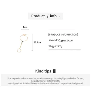Detail van vergulde hart-handketting met zirkoon, inclusief maat- en materiaalinformatie.