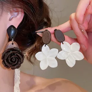 Vintage ethnic style floral drop earrings featuring wooden beads and elegant rose flower design