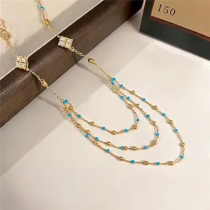 Elegant Korean style gold necklace featuring zircon rhombus charms and blue beads
